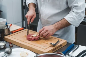 Steak tartare served on a plate with garnish