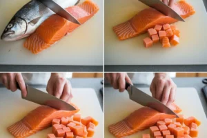 Salmon fillet being cut into uniform cubes on a cutting board.